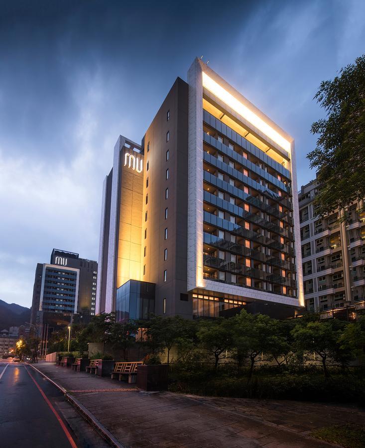 โรงแรมมู่ เจียว สี เจียวซี ภายนอก รูปภาพ NU Hotel