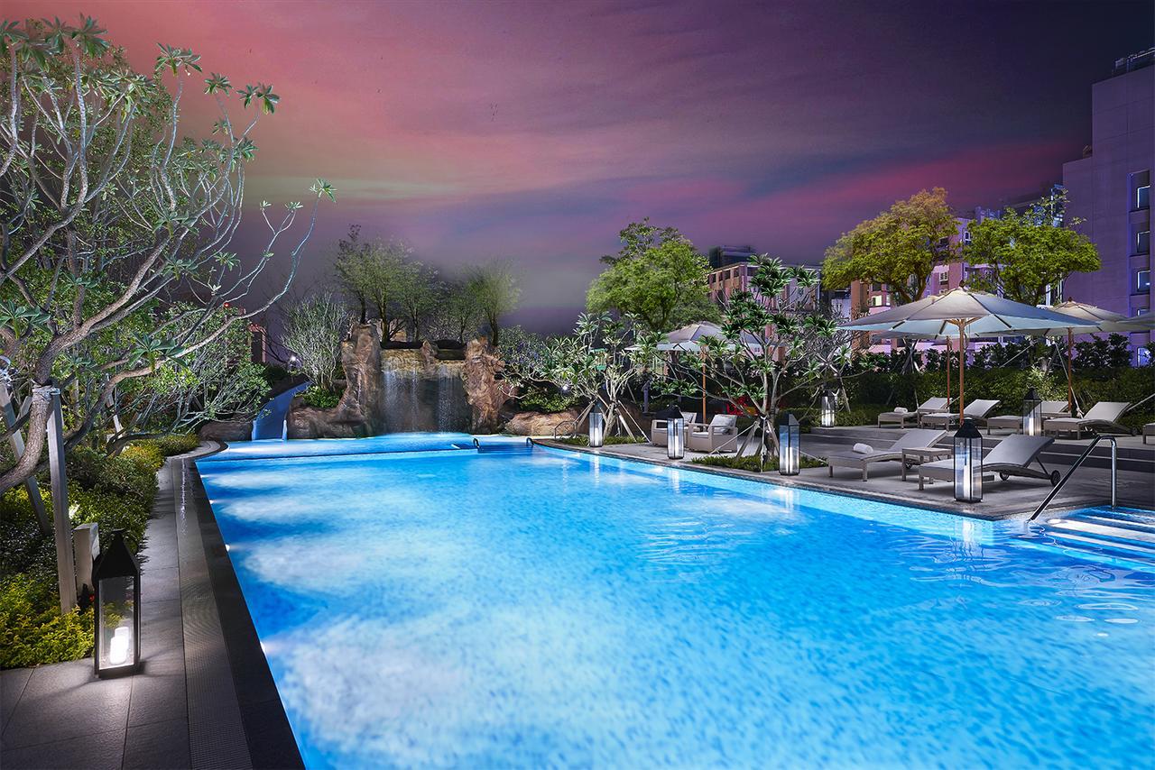 โรงแรมมู่ เจียว สี เจียวซี ภายนอก รูปภาพ The swimming pool at the hotel