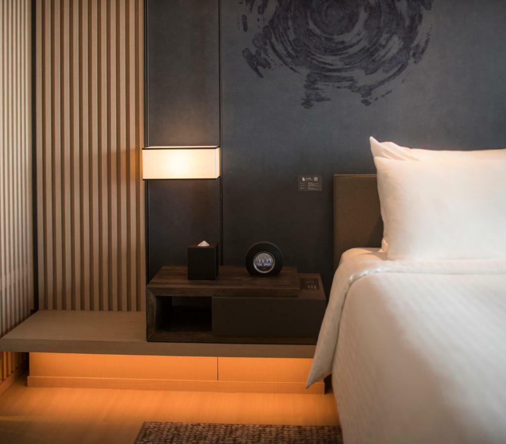 โรงแรมมู่ เจียว สี เจียวซี ภายนอก รูปภาพ A room at the hotel
