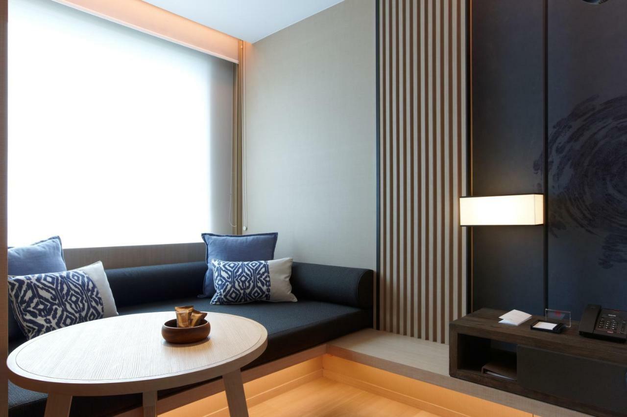 โรงแรมมู่ เจียว สี เจียวซี ภายนอก รูปภาพ A room at the hotel