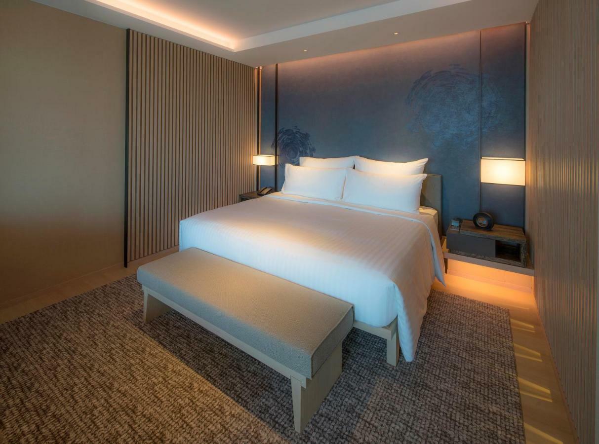 โรงแรมมู่ เจียว สี เจียวซี ภายนอก รูปภาพ A bedroom at the hotel