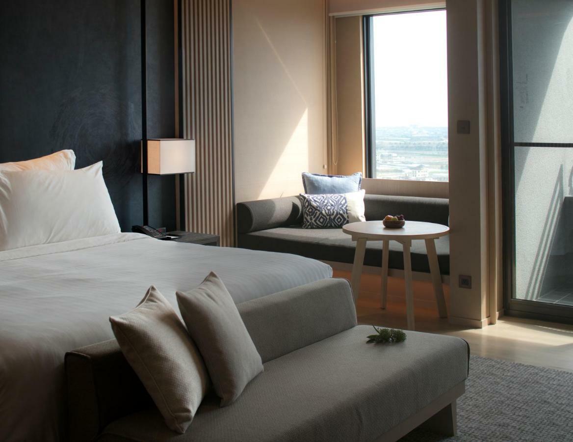 โรงแรมมู่ เจียว สี เจียวซี ภายนอก รูปภาพ A bedroom at the hotel